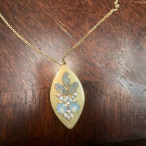 18” drop pendants studded with opal like stones and adorned with 12 crystals.